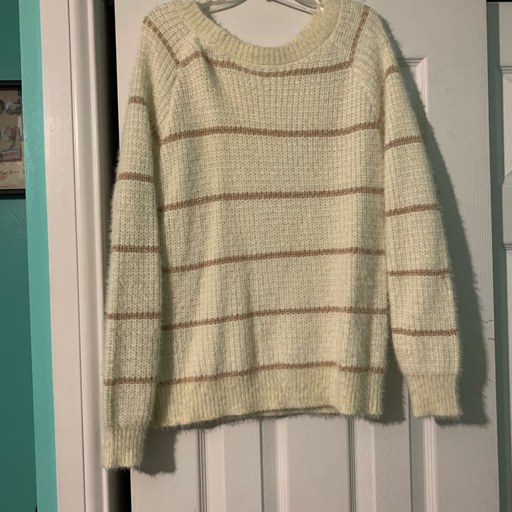 Cream and gold sweater.